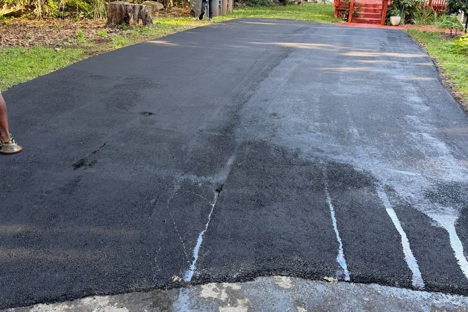 A freshly paved residential driveway by Top Notch Paving